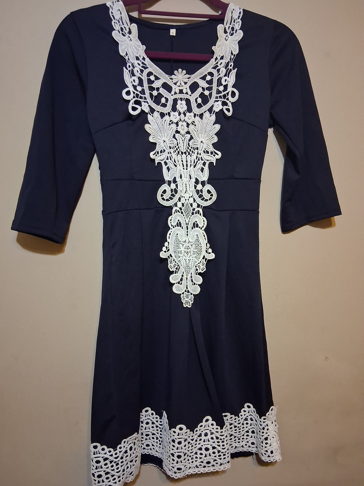 Navy & White Lace Accent Dress featuring intricate lace detailing and flattering 3/4 sleeves.