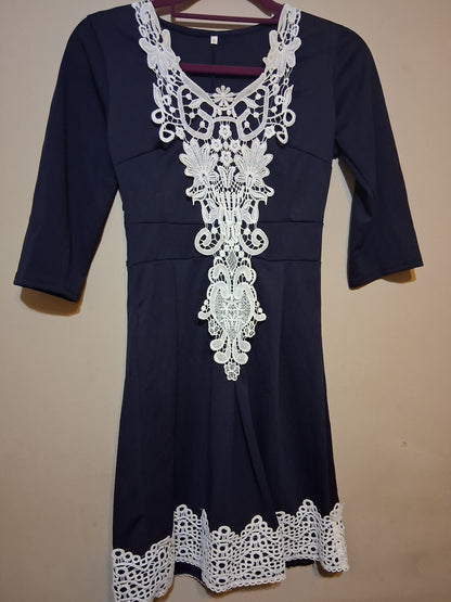 Navy & White Lace Accent Dress featuring intricate lace detailing and flattering 3/4 sleeves.