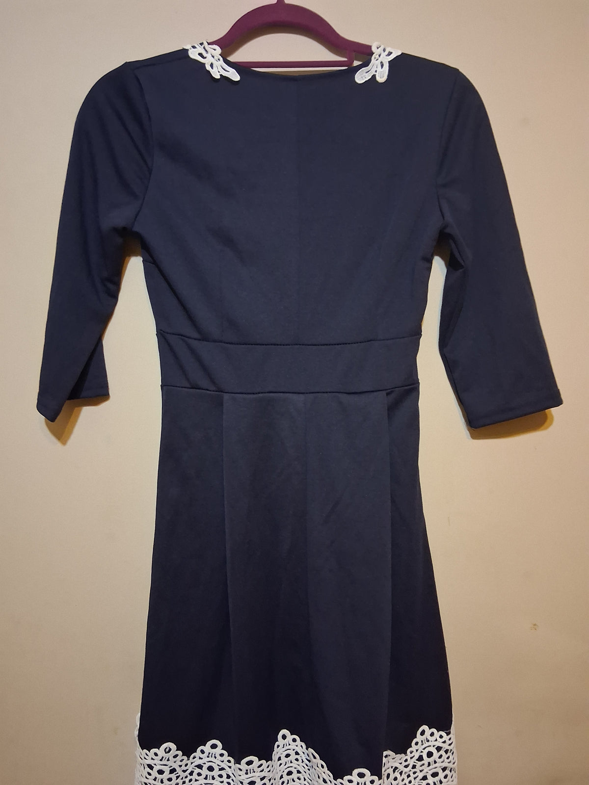 Navy & White Lace Accent Dress featuring 3/4 sleeves and delicate white lace hem detail.