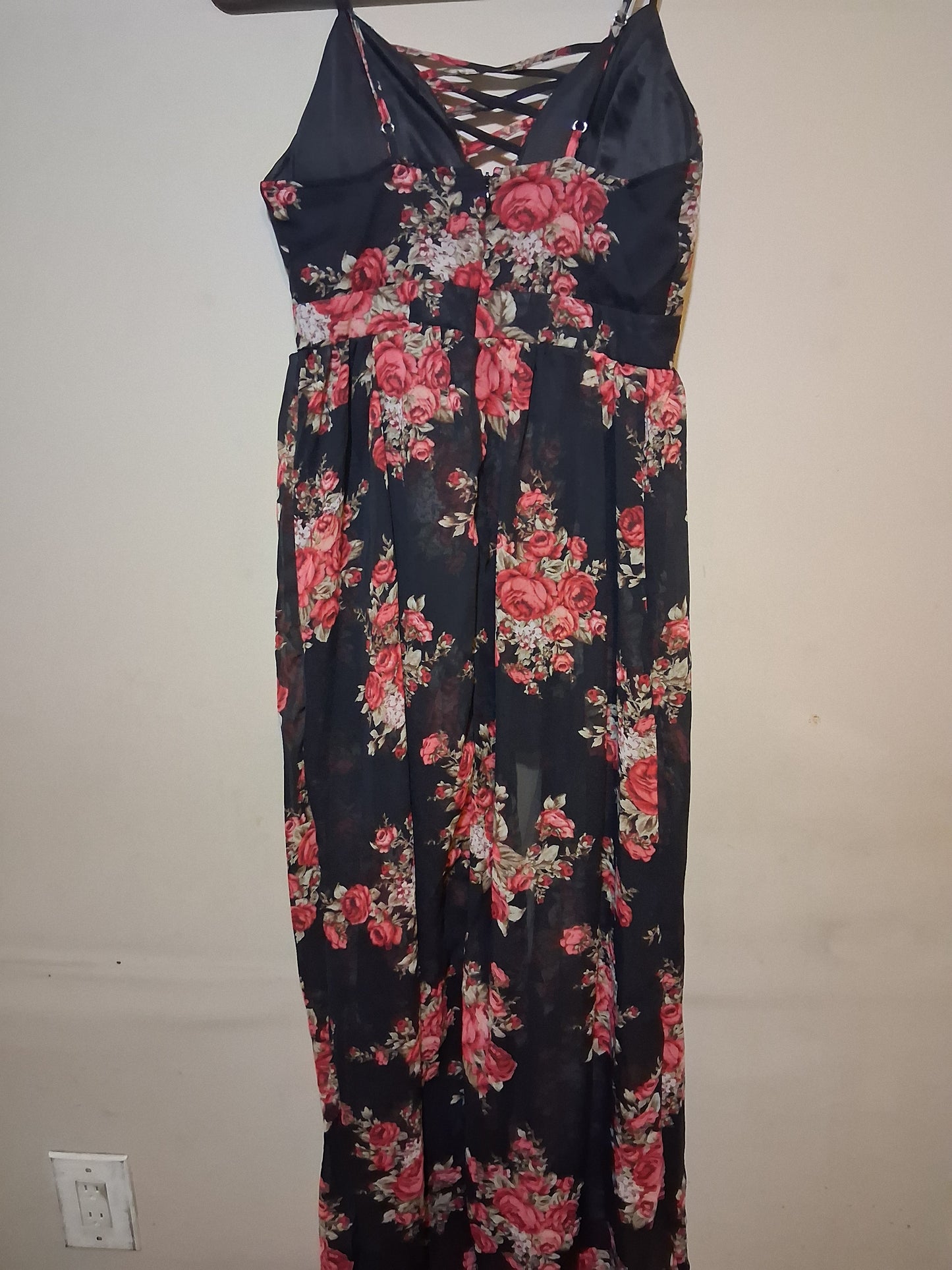 Floral Lace-Up Wide Leg Jumpsuit featuring a black background with vibrant pink and red floral patterns.